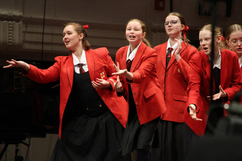 Members of Seraphim from Chilton Saint James School bring the theatre to their number at The Big Sing Finale 2025.