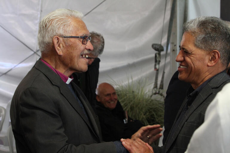 Pīhopa Ngarahu greets Maui Tangohau in the hongi line.