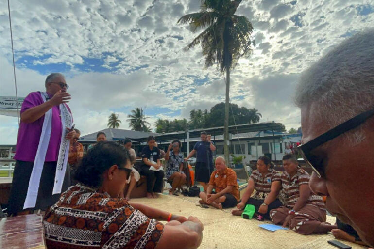 Archbisbishop Sione Ulu'ilakepa prays for the crew of the Uto Ni Yalo vaka.