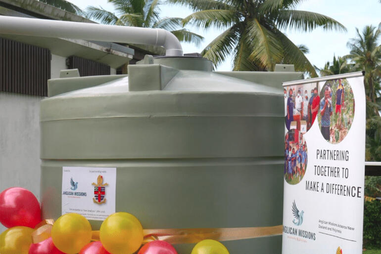 A water tank goes in beside an Anglican Church in Fiji as an emergency resilience resource.