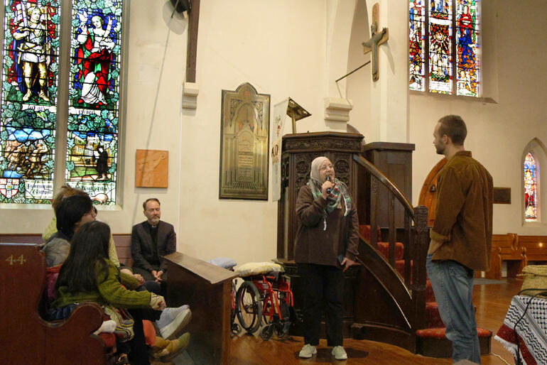 Well known Dunedin Palestinian Dr Mai Tamimi thanks Cole for the update from her home region as Archdeacon Michael Wallace looks on.